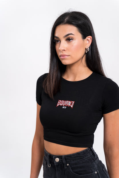 female model with a tight t-shirt on, white background