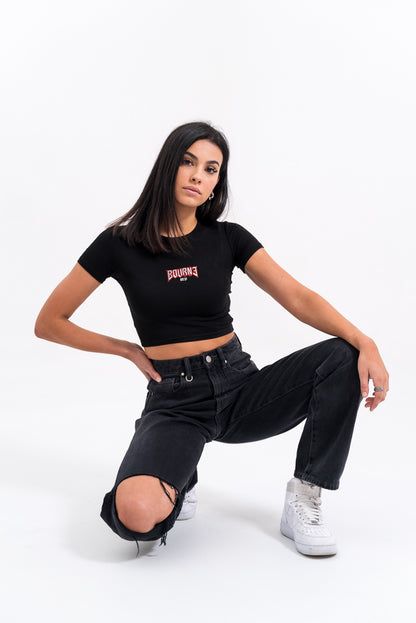 female model with a tight t-shirt on, white background