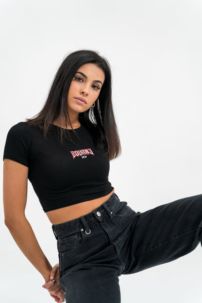 female model with a tight t-shirt on, white background