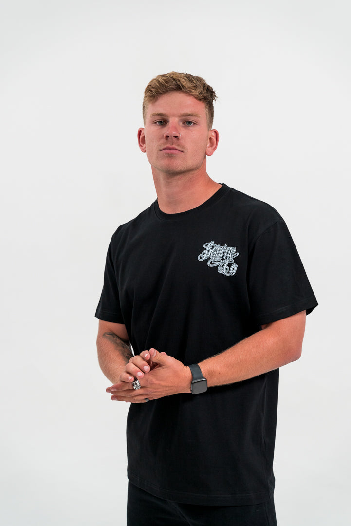 male model wearing black t-shirt, white background