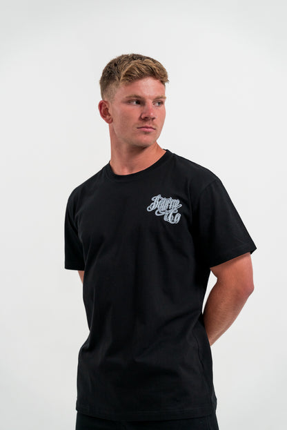 male model wearing black t-shirt, white background